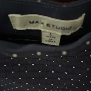 Navy blue with white polka dots, knee length, with ruffle .